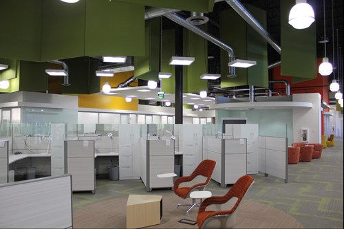 Open office with green MBI Baffles installed to curb office noise